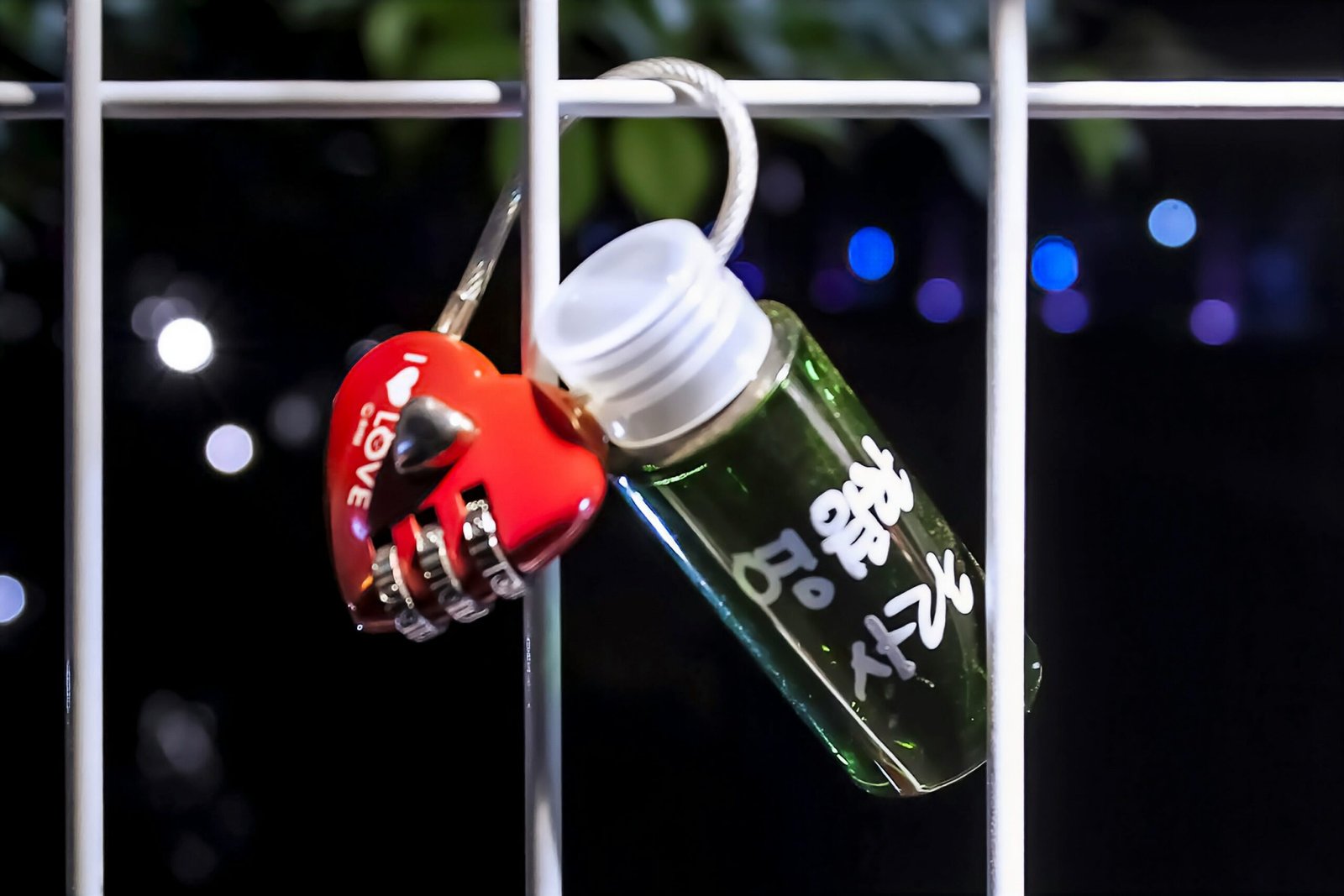 a bottle with a keychain attached to it